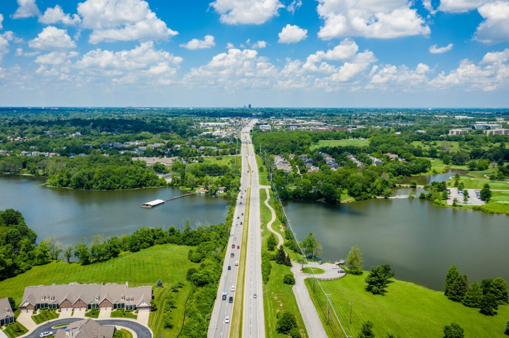 Aerial view cars on the bridge over the river expressway in the big city