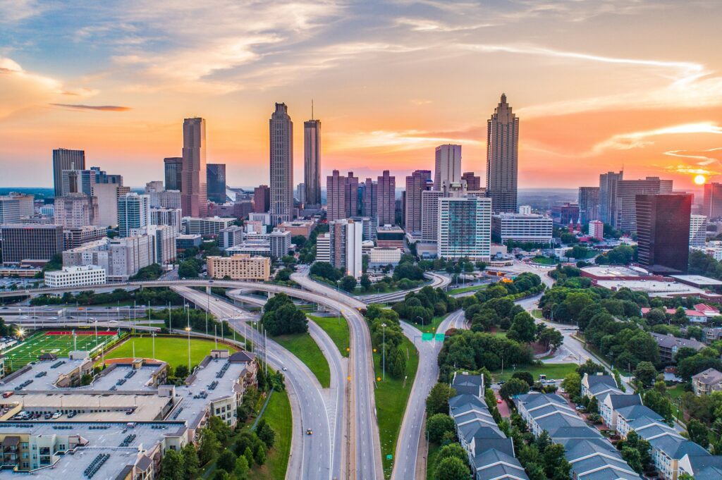 Sunset over Atlanta with tall buildings and skyscrapers