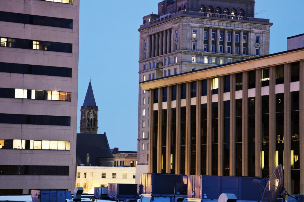 Evening view of urban buildings with illuminated windows