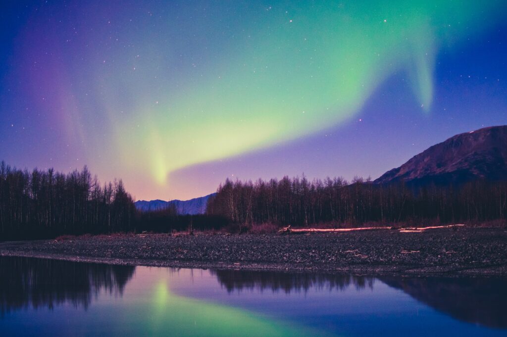 Northern lights over mountains landscape of Alaska