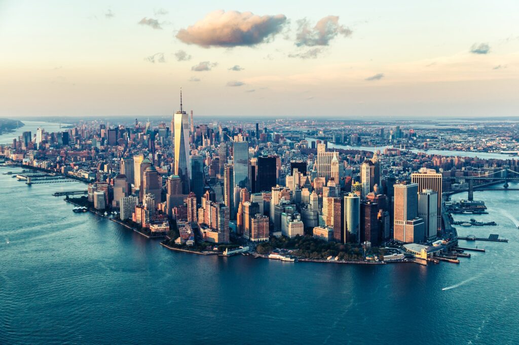 Tall buildings in the city beside body of water