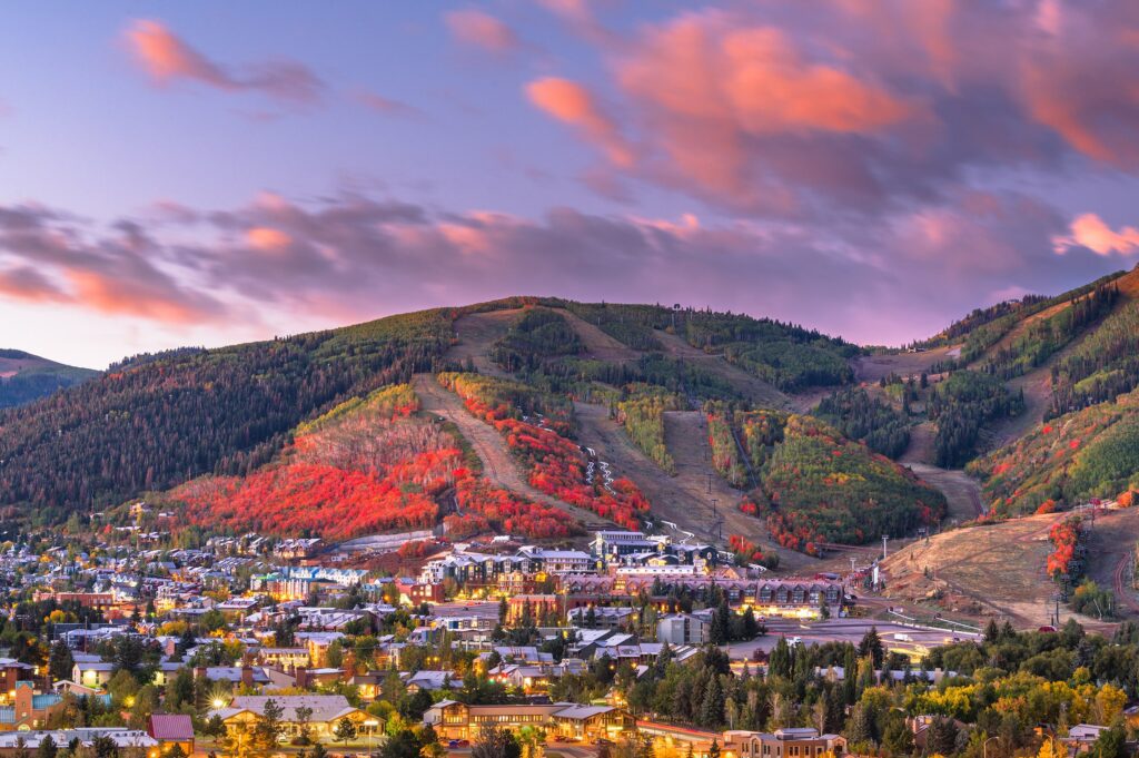 A sunset with colorful autumn foliage on the mountains