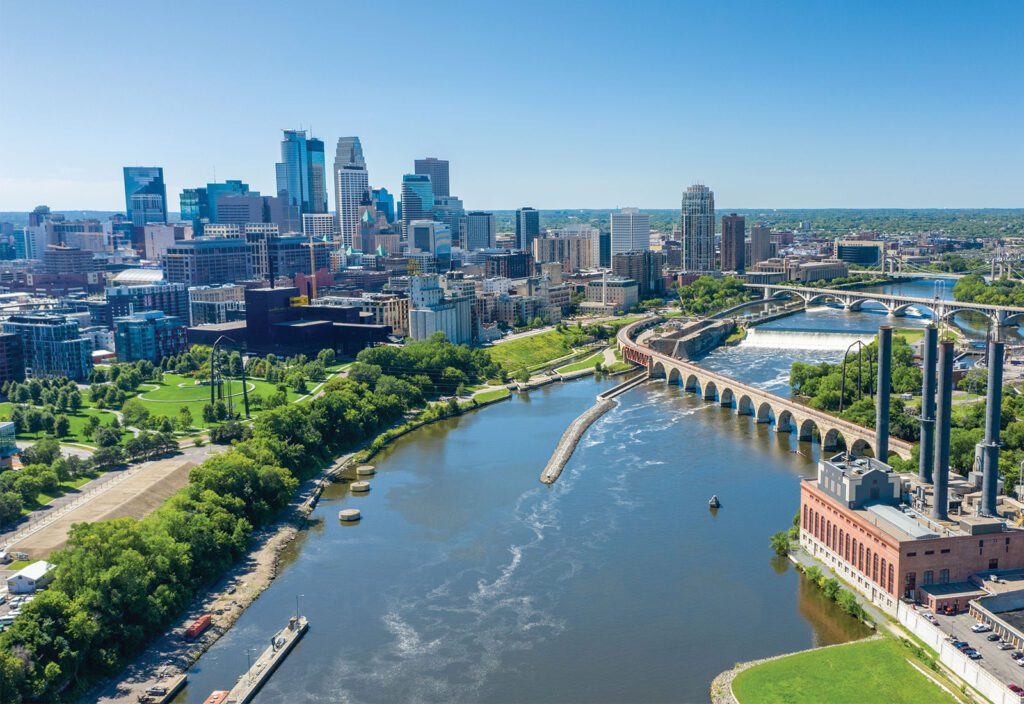 Minneapolis skyline with a river and bridges in view